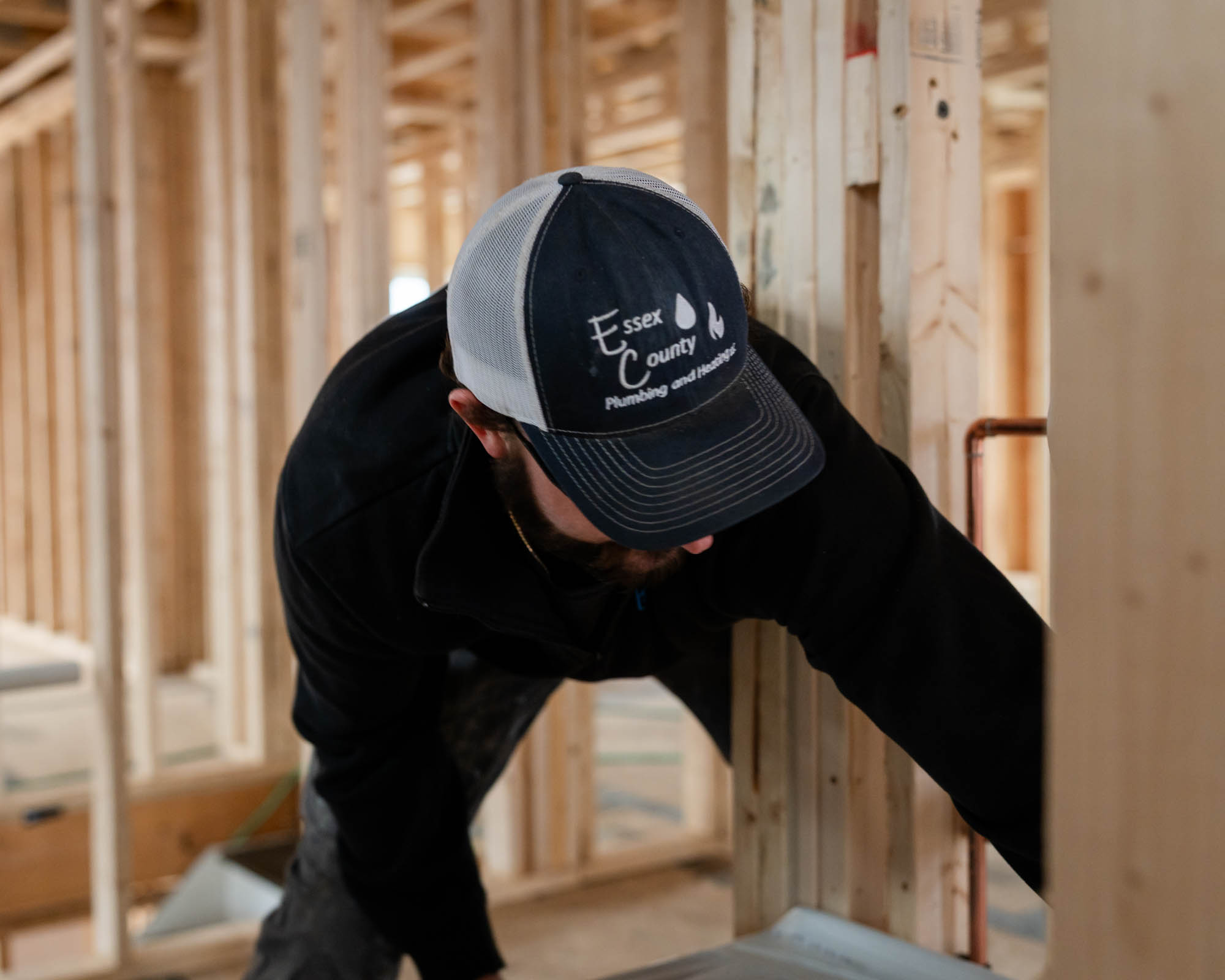 Essex County Plumbing and Heating crew installing bathtub on Essex County MA renovation jobsite