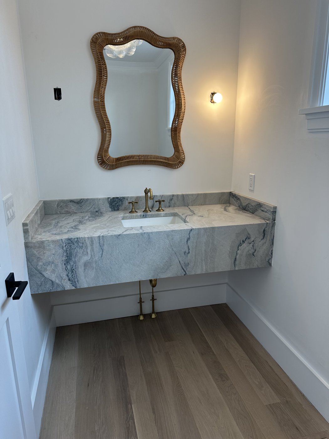 Powder room with marble floating vanity - bathroom renovation plumbing