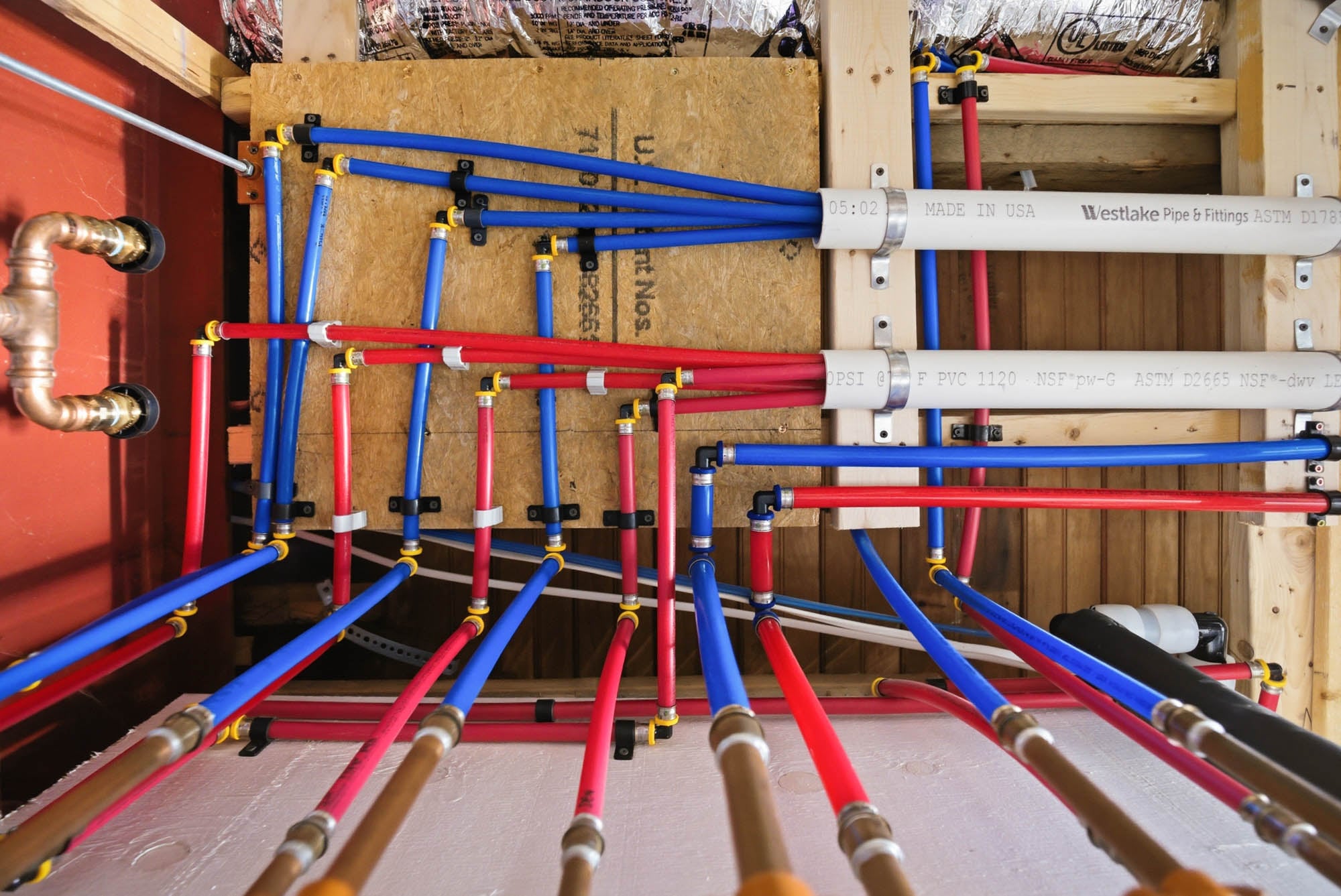 PEX home-run manifold — red/blue hot + cold lines to every fixture - Essex County MA
