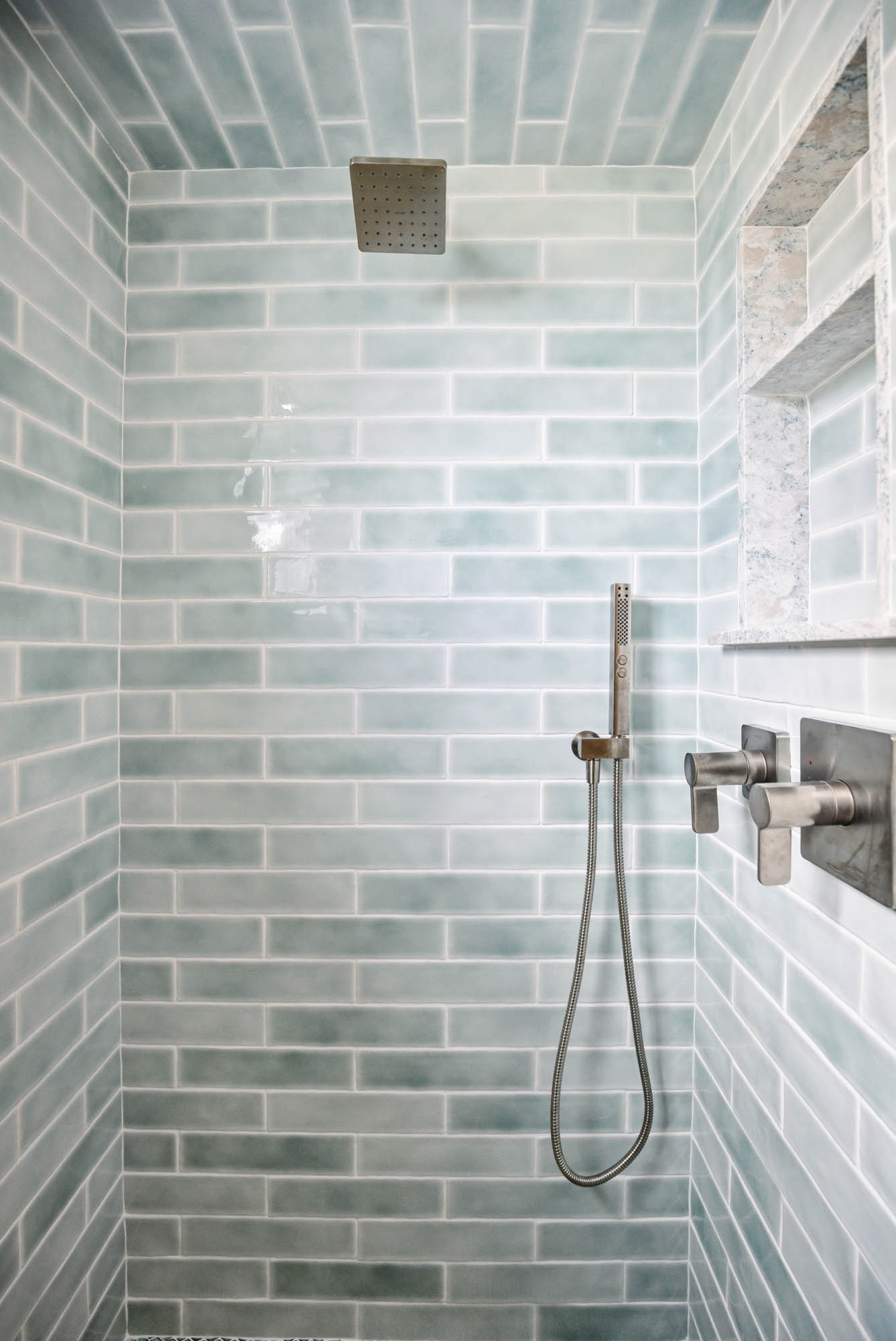 Sea-glass green subway tile shower with nickel fixtures - bathroom renovation plumbing